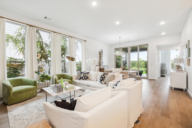 living room with a wealth of natural light and hardwood / wood-style floors