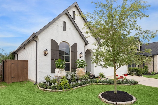 view of front of house with a front yard and a garage