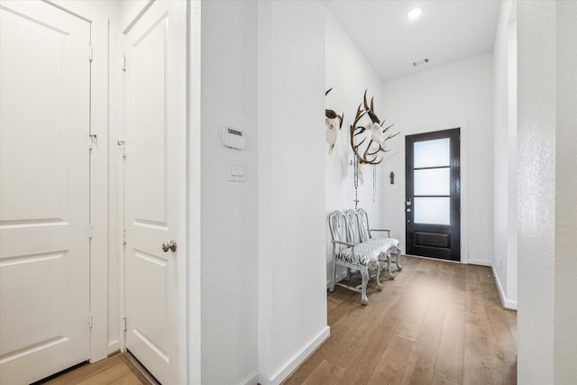 interior space with hardwood / wood-style floors