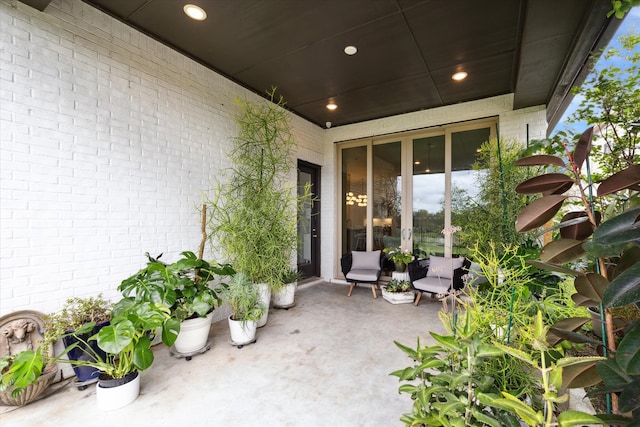 property entrance featuring a patio area