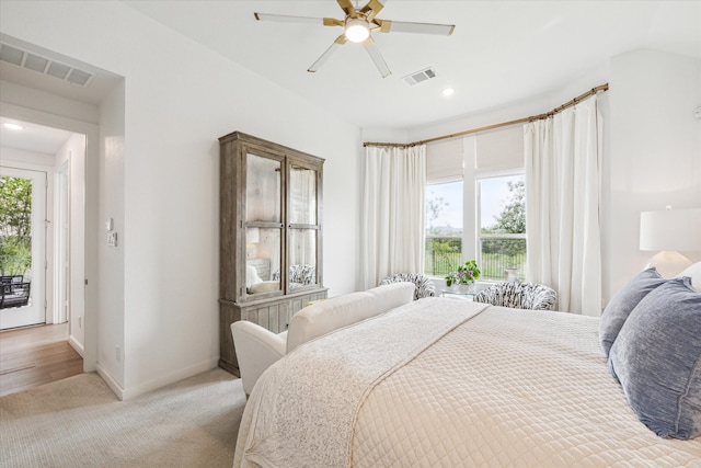 carpeted bedroom with ceiling fan and access to exterior