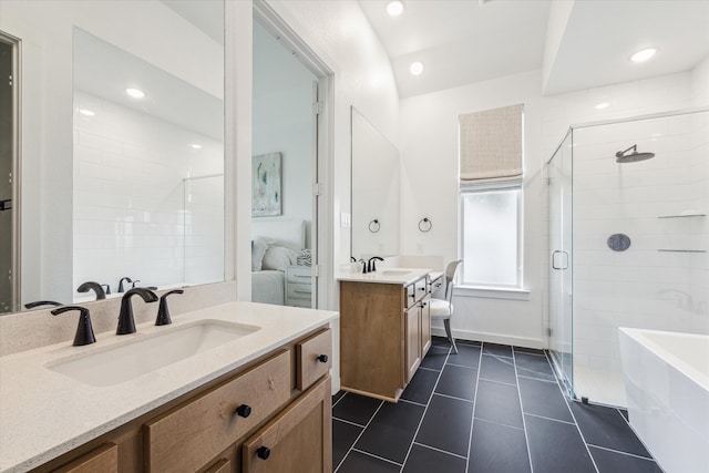 bathroom with independent shower and bath, tile flooring, and vanity