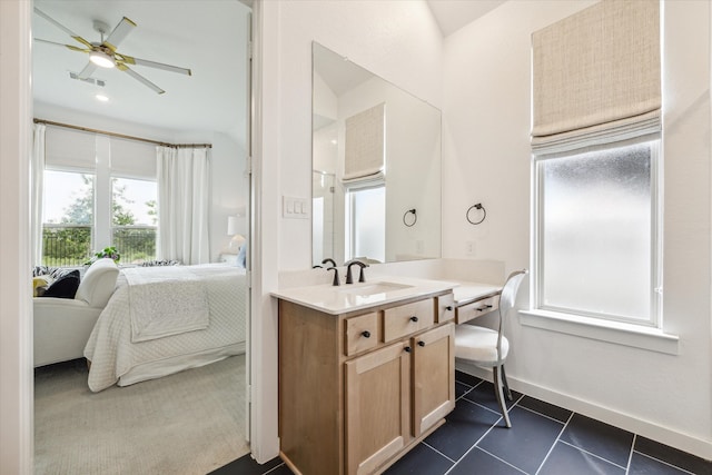 bathroom featuring tile flooring, oversized vanity, and ceiling fan