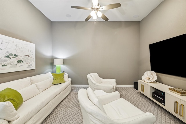 living room featuring carpet floors and ceiling fan