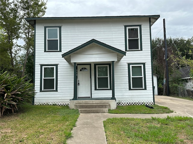 view of front of house with a front lawn