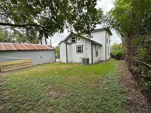 view of yard with central AC unit