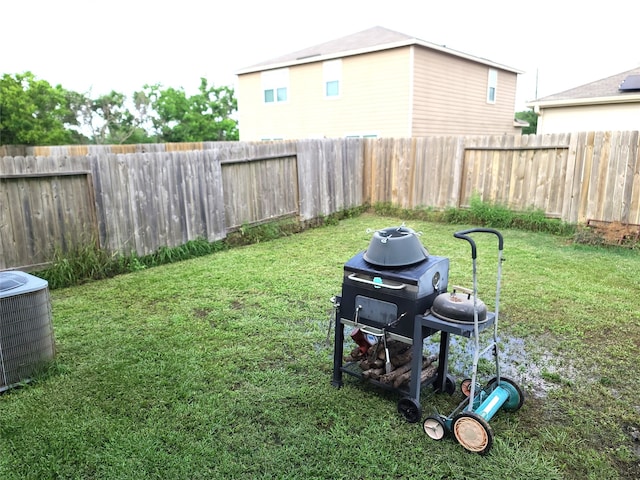 view of yard with central air condition unit