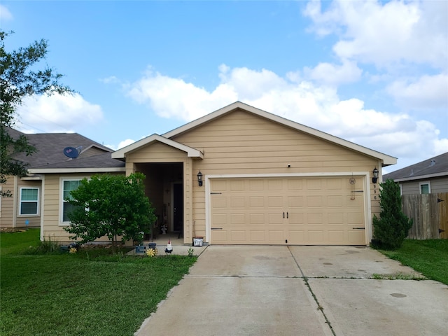 single story home with a garage and a front lawn