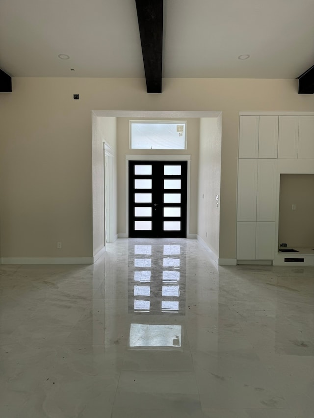 entrance foyer with beamed ceiling