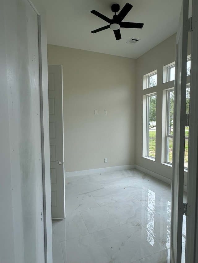 unfurnished room featuring ceiling fan