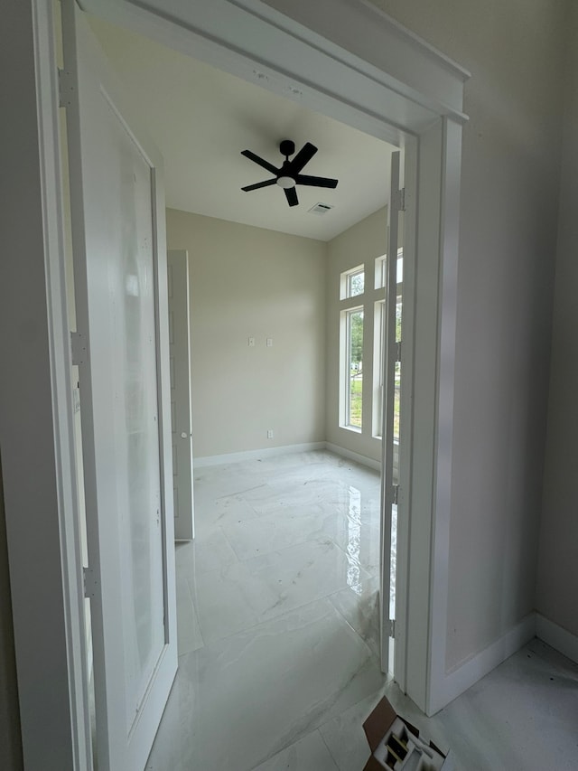 empty room featuring ceiling fan