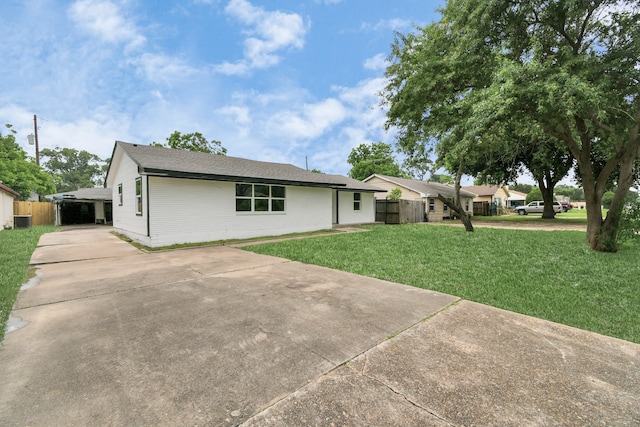 ranch-style home with a front lawn