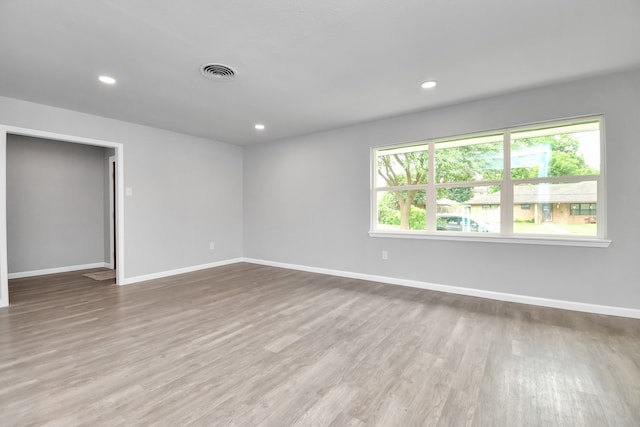 empty room with wood-type flooring