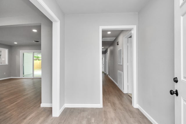 hall with light hardwood / wood-style floors