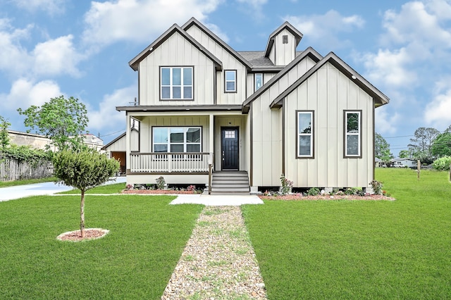 modern farmhouse style home with a front lawn