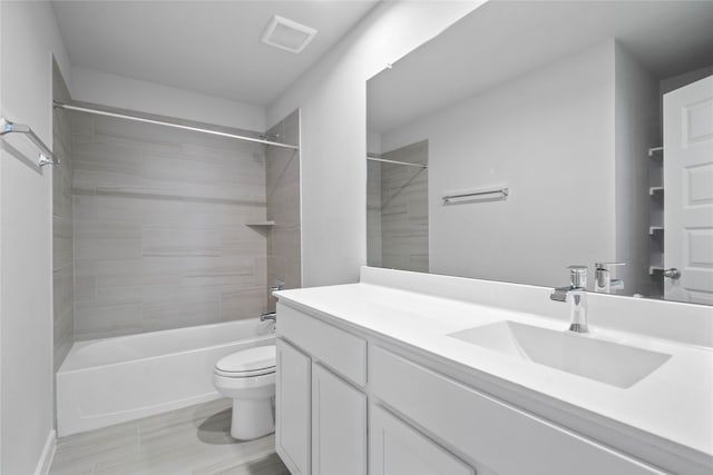 bathroom featuring toilet, tub / shower combination, vanity, and visible vents