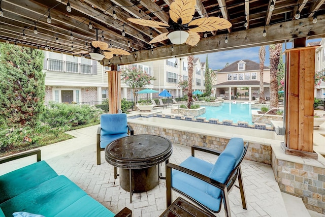 view of terrace featuring ceiling fan and outdoor lounge area