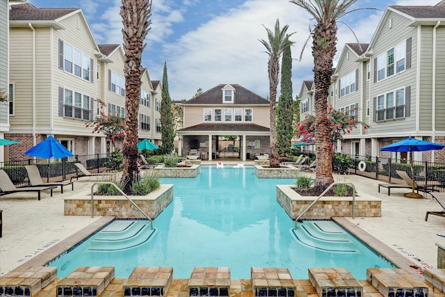 view of pool featuring a patio area