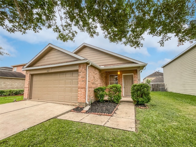 view of front of home featuring a front lawn and a garage