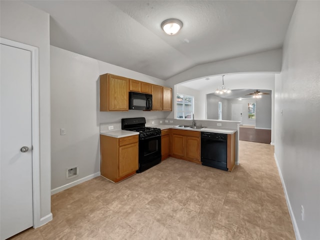 kitchen featuring kitchen peninsula, black appliances, lofted ceiling, sink, and light tile floors