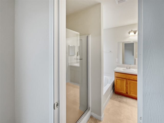 bathroom featuring vanity, separate shower and tub, and tile floors