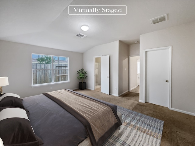 bedroom featuring vaulted ceiling and carpet flooring