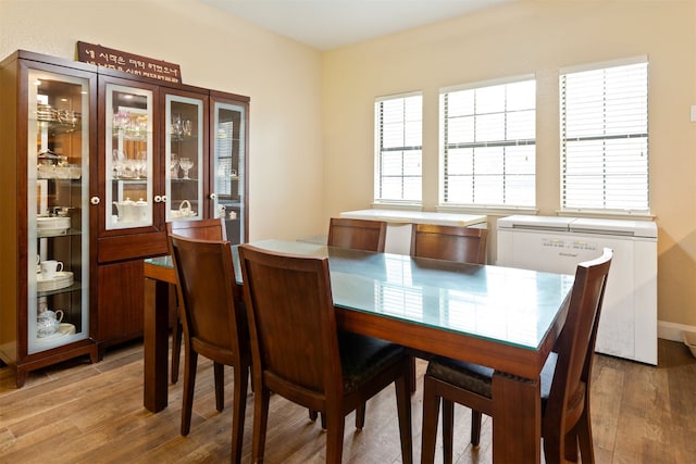 dining space with light wood-type flooring