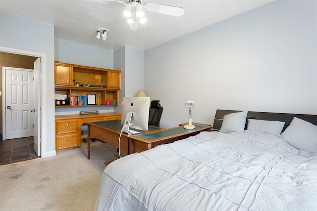 bedroom featuring light carpet and ceiling fan