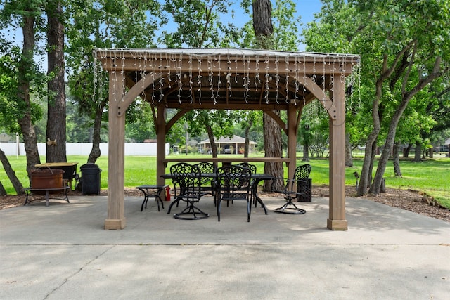 view of home's community featuring a patio area, a lawn, and a gazebo