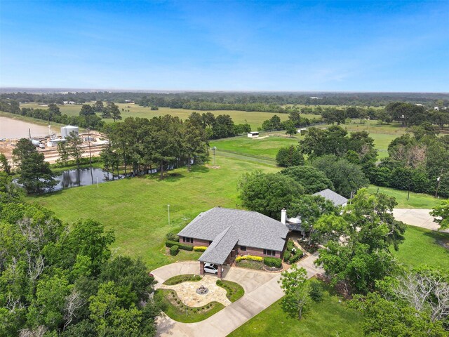 birds eye view of property with a rural view