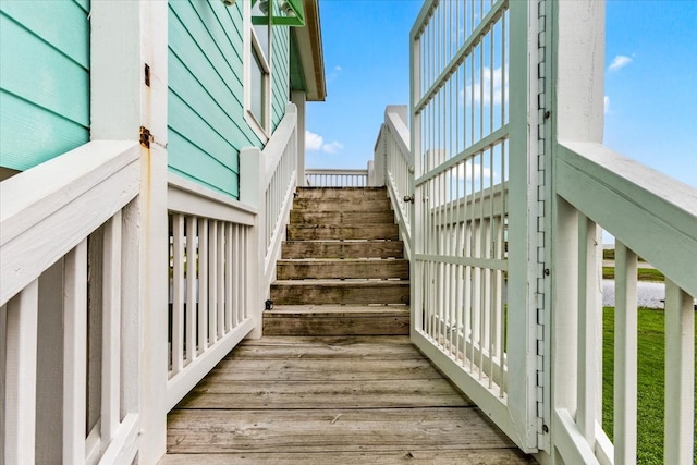 staircase with wood-type flooring