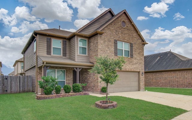 view of front facade with a garage, a front yard, and an outdoor fire pit