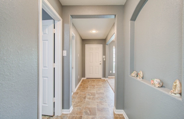 hallway with light tile flooring