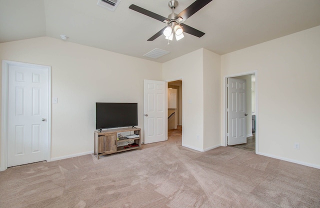 unfurnished living room featuring light carpet, lofted ceiling, and ceiling fan