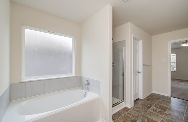 bathroom featuring tile flooring and shower with separate bathtub