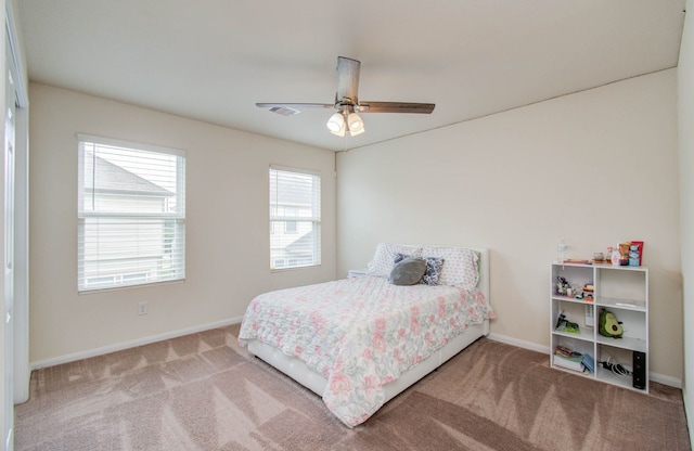 bedroom with ceiling fan and carpet floors