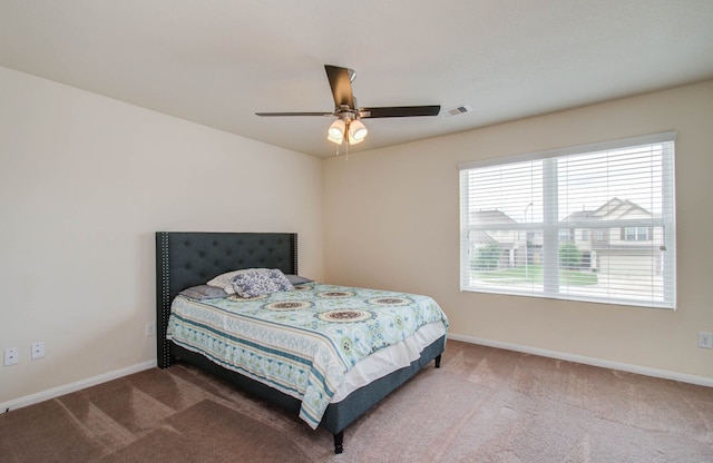 bedroom featuring ceiling fan and carpet floors