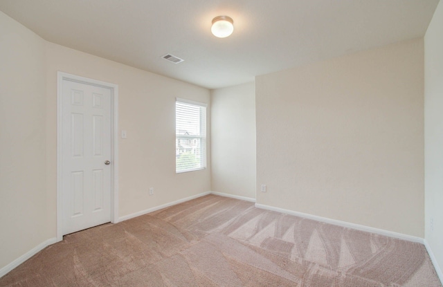 spare room featuring carpet floors