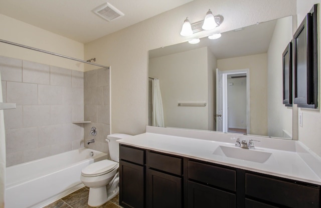 full bathroom with tile flooring, vanity with extensive cabinet space, shower / bath combo with shower curtain, and toilet