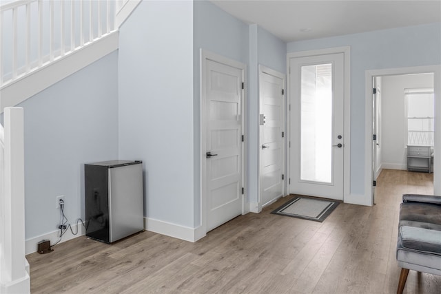 entrance foyer with light wood-type flooring