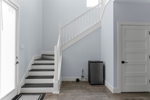 stairway featuring hardwood / wood-style floors