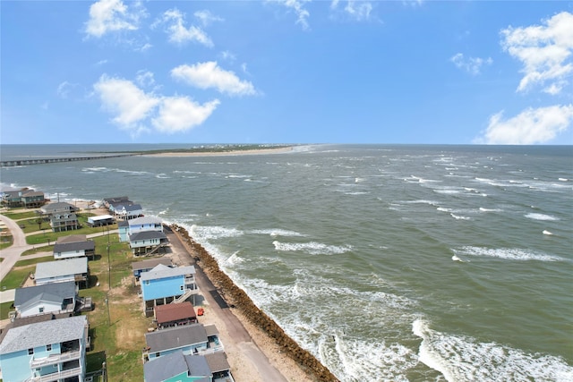 drone / aerial view featuring a view of the beach and a water view