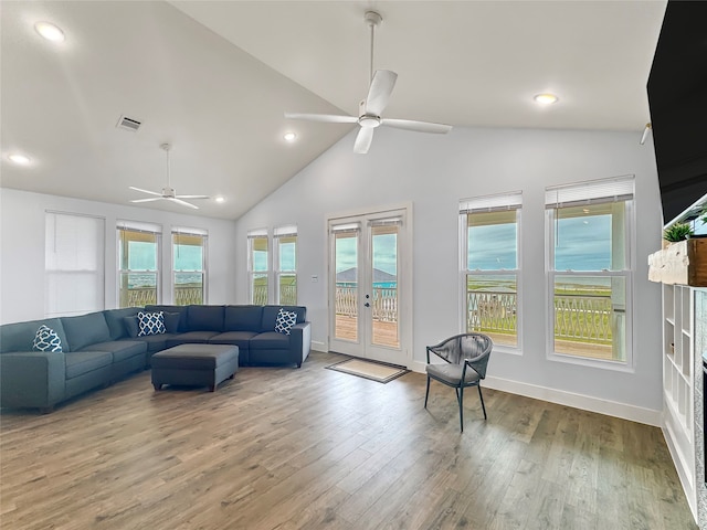 living room with french doors, hardwood / wood-style flooring, and ceiling fan