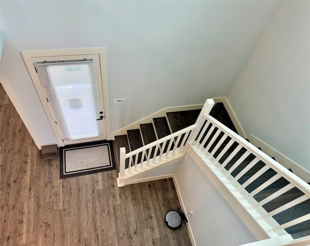 stairway featuring hardwood / wood-style flooring