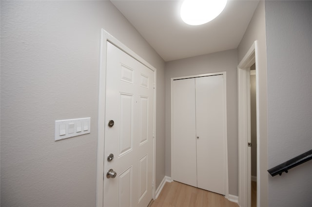 hallway with light wood-type flooring