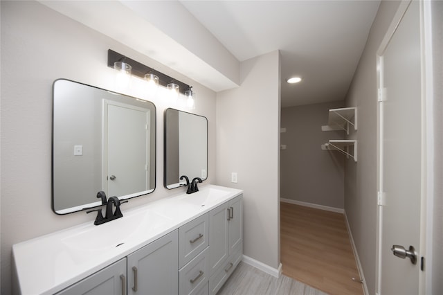 bathroom featuring vanity and hardwood / wood-style flooring