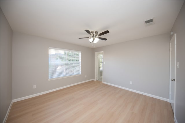 empty room with ceiling fan and light wood-type flooring