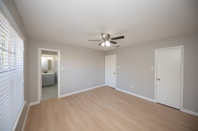 unfurnished room with ceiling fan and light hardwood / wood-style floors