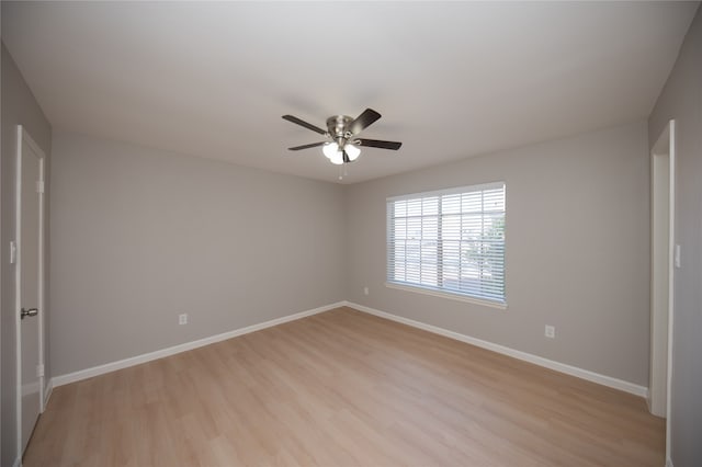 spare room featuring ceiling fan and light hardwood / wood-style flooring