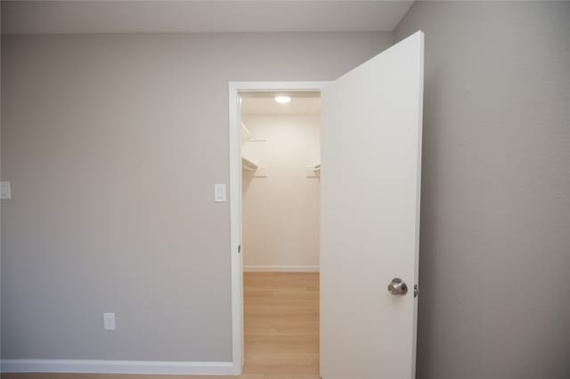 corridor featuring light hardwood / wood-style floors